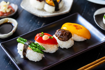 Vegan sushi with tomato, mushroom and asparagus