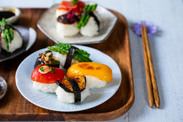 Vegan sushi with tomato, mushroom and aubergine