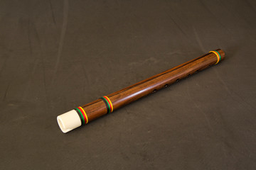 quena (from Quechua quena) traditional wind instrument used by the inhabitants of the central Andes.Peru, made with llama bone