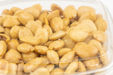 Salted dry roasted almonds in store packaging.
