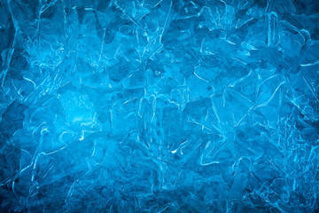 Background of blue cold winter ice. Texture of frozen surface. Frost pattern