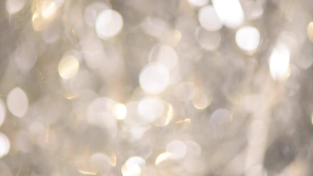 Silver abstract bokeh lights. Festive defocused background. New year and Christmas concept. Greeting card