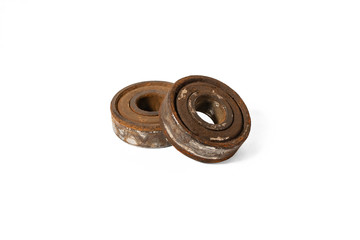 Rusty stuck ball bearings on a white background isolated