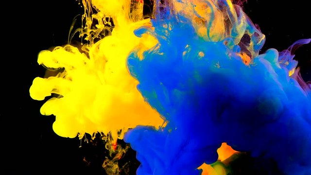 Color paint drops in water , abstract color mix , drop of Ink color mix paint falling on water Colorful ink in water, 4K footage,