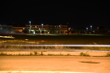 Night Road Illuminated by lamps with Light Trails