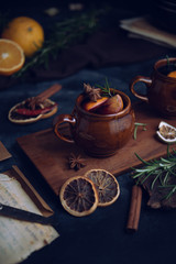 Warming mulled wine on dark background