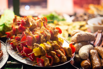 Varied food at the annual Christmas market. Grilled sausages, kebab, grilled vegetables, french fries and other tasty food