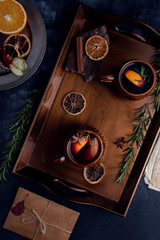 Warming mulled wine on dark background