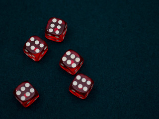 red Dices on green casino table