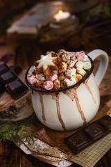 Hot chocolate with marshmallow on dark background