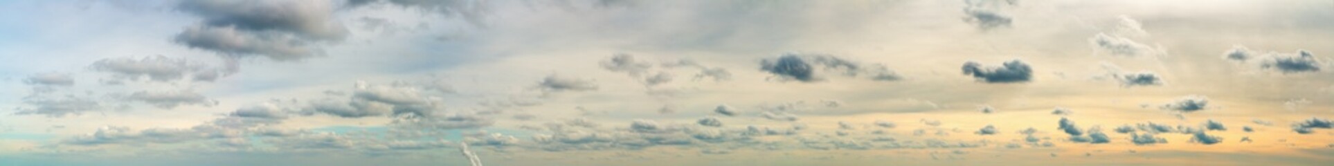 Fantastic clouds against blue sky, panorama