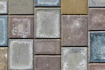Colored paving stones on the footpath as background