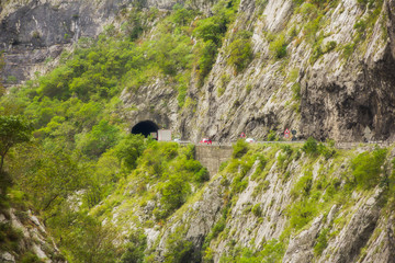 Views of road trough tunnels, canyons, mountains and forests in the Durmitor nature park, Montenegro