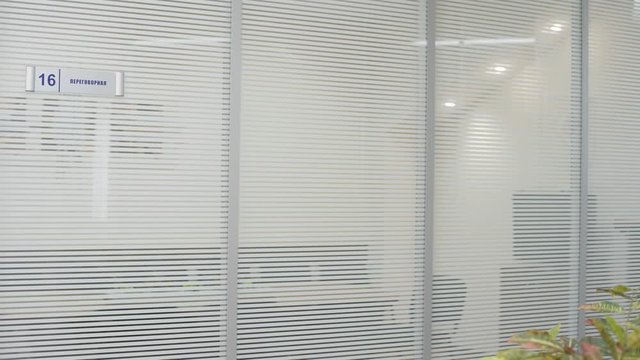 Business man walking down the office corridor