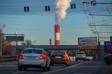 Cars on the highway and smoking  pipe in Moscow