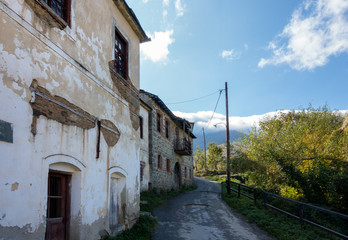 Street with old houses in Akritas village, Florina, Greece 