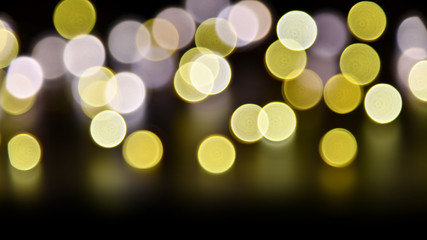 Abstract bokeh background of defocused lights. Merry Christmas and New Year background. Holiday glowing background and wallpaper. Blurred Bokeh.