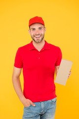 Transportation goods. Transportation concept. Transporting. Performance on time worldwide. Smooth transition. Courier delivery. Postman worker. Man red cap yellow background. Transportation agency