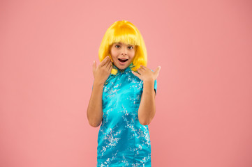 Anime admirer. Girl yellow wig. Cosplay character concept. Japanese style. Eastern trends for teens. Hobby and entertainment. Pop culture. Anime fan. Child cute cosplayer. Anime emotional expression