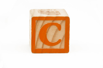 wooden block with the letter c isolated on white background