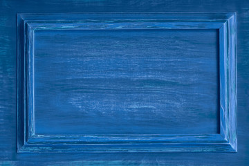 Painted wooden surface in trending classic blue. Color of year 2020. Center the box for the inscription