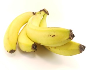 ripe yellow bananas on a white background