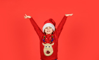 Christmas party time. ready for new year party. christmas my favorite holiday. love winter holidays. in xmas mood. little santa helper feel happy. small girl santa claus hat red background