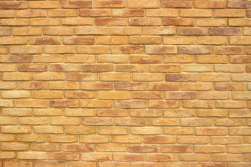Background image of a large section of masonry, consisting of bricks of different shades of brown. Aged in retro style.