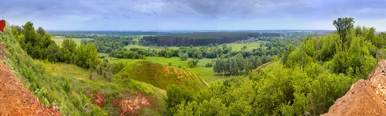 Fototapeta na wymiar Spring landscape - view of the river valley which meanders between hills and forests on the northeast of Ukraine