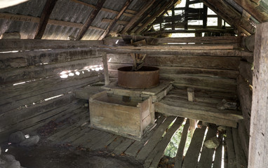 Interior of old water mill for grinding grain near Gârnic, Banat, Romania