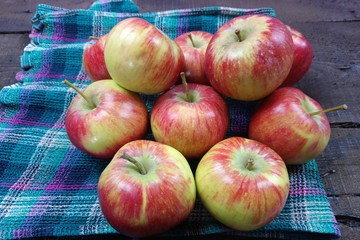 red apples on wooden table