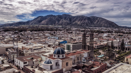 Fototapeta na wymiar Tepic Cathedral in city centre of Tepic. State Nayarit in Mexico. Aerial drone view of Tepic and San Juan mountain.