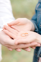 Rings on man's and woman's hands