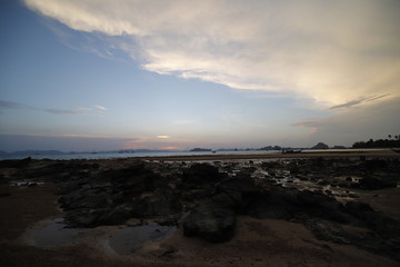 Sunset in the beach with a boat, Thailand 