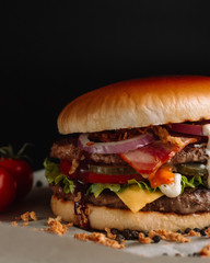 Perfect hamburger classic burger american cheeseburger with cheese, bacon, tomato and lettuce