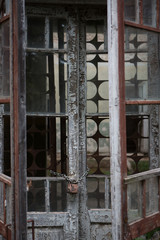 old window with broken glass and wooden frame	