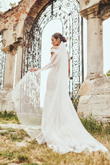 Bride in wedding dress on background of old european city