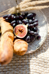 Fresh fruits on a plate outdoors