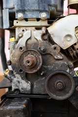 Close up view of an old, not working two cycle motor