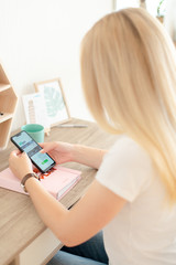 Woman writing on a smartphone 