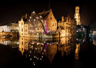 Fototapeta na wymiar Reflections of Christmas lightings on Bruges canals