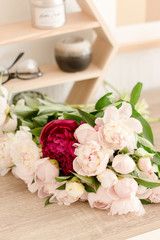 Fototapeta na wymiar bouquet of peonies on the table