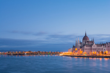 Fototapeta na wymiar The Hungarian Parliament building at sunrise on the Danube river bank, Budapest, Hungary