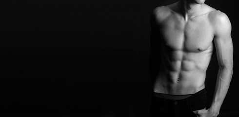 Fototapeta premium Muscular fit male body , black and white photo 