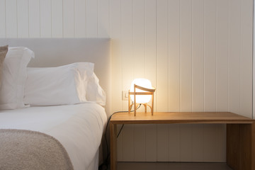 Hotel bedroom interior with double bed and complements © Cvilaclara