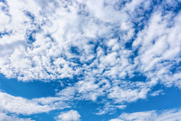 Bright blue dramatic cloudy sky on summer day.