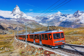 Zermatt, Switzerland. Gornergrat tourist train with Matterhorn peak. - obrazy, fototapety, plakaty