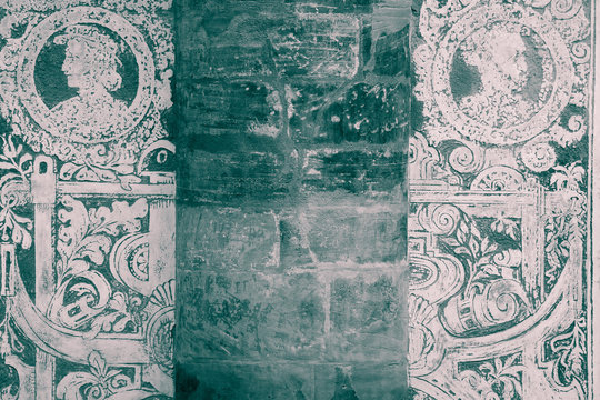 Grunge sgraffito renaissance wall background  - Detail of the facade of Ball Game Hall (built in 1569) in Royal Garden of Prague Castle, Czech Republic - black and white photograph with dark teal tint