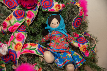  Christmas tree with traditional Mexican decorations, rag dolls, traditional colored ribbons of Mexican culture