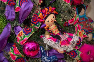 Christmas tree with traditional Mexican decorations, rag dolls, traditional colored ribbons of Mexican culture